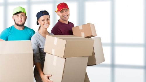 Local removals team handling furniture for a home move in Crystal Palace