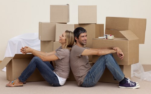 Professional movers handling furniture in a Crystal Palace home