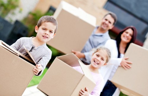 Professional movers navigating stairs in a Crystal Palace property