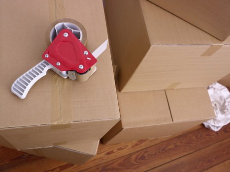 Packed boxes and labeled belongings ready for a house move in Crystal Palace